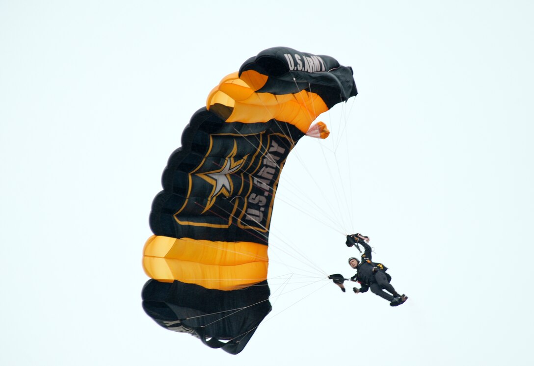 A parachutist with the U.S. Army Golden Knights Parachute Team prepares to land June 13, 2015, during the Wings Over Whiteman air show at Whiteman Air Force Base, Mo. The Golden Knights have conducted more than 16,000 shows in 50 states and 48 countries over the past 53 years. (U.S. Air Force photo by Staff Sgt. Brigitte N. Brantley/Released)