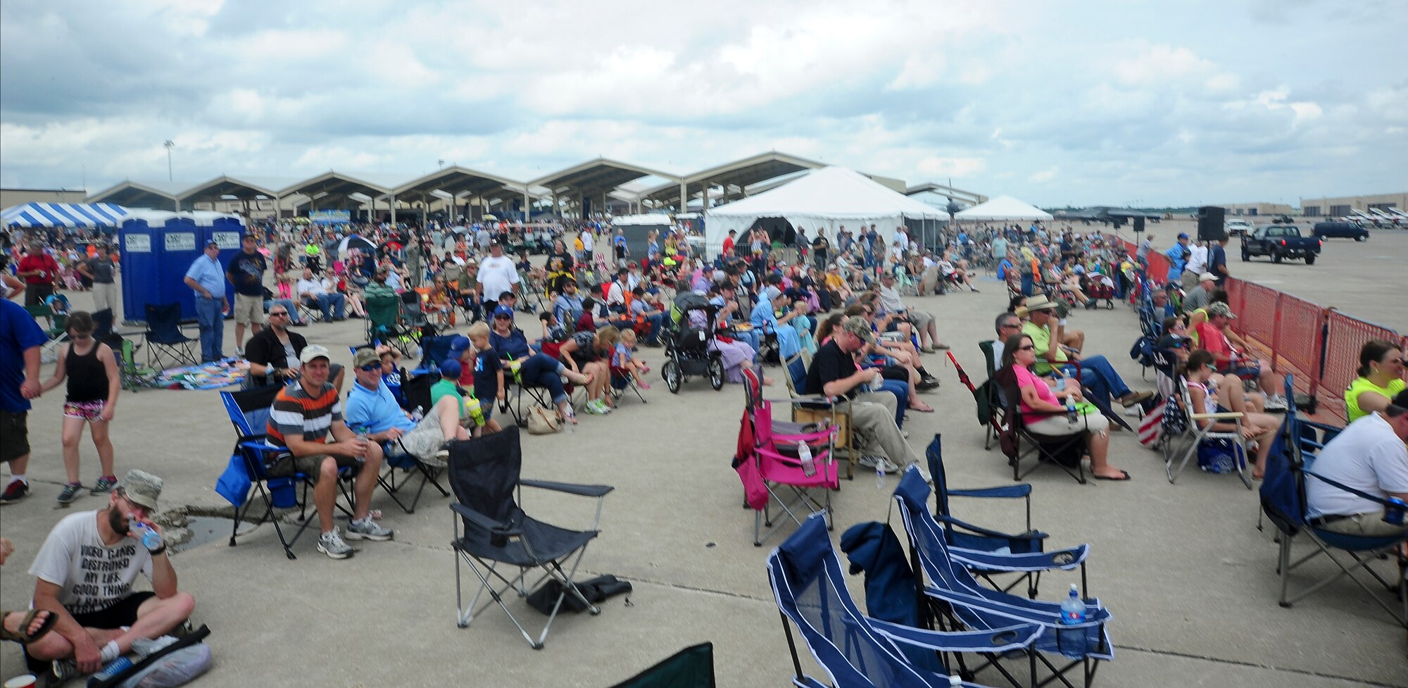 Spectators wait for the next act during the Wings Over Whiteman air show June 13, 2015, at Whiteman Air Force Base, Mo. Air shows allow the men and women of the U.S. military to thank the public for their support by displaying some of the aircraft in their inventory. (U.S. Air Force photo by Staff Sgt. Brigitte N. Brantley/Released)
