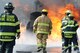 U.S. Air Force and New Jersey state fire protection specialists from the New Jersey Air National Guard's 177th Fighter Wing battle a simulated aircraft fire at Military Sealift Command Training Center East in Freehold, N.J. on June 12. Airmen from the Wing hold annual training here to maintain mission readiness. (U.S. Air National Guard photo by Airman 1st Class Amber Powell/Released)