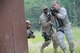 U.S. Air Force Staff Sgt. Mark Naughton, right, and Senior Airman Mathew Joseph, center, Security Forces Specialists from the New Jersey Air National Guard's 177th Fighter Wing, round the corner of a building, while Staff Sgt. John Lundy provides low cover during urban operations training at Joint Base McGuire-Dix-Lakehurst, N.J. on June 11. (U.S. Air National Guard photo by Airman 1st Class Amber Powell)