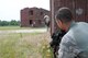 U.S. Air Force Staff Sgt. Mark Naughton, a Security Forces Specialist from the New Jersey Air National Guard's 177th Fighter Wing, looks around the corner of a building as his team works their way across an urban ops training village at Joint Base McGuire-Dix-Lakehurst, N.J. on June 11. (U.S. Air National Guard photo by Airman 1st Class Amber Powell)