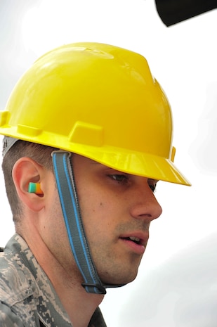 U.S. Air Force Staff Sgt. Ryan Cassady, 5th Munitions Squadron munitions system technician, guides an inert MK-62 Quick Strike Mine body onto a trailer during a mine build at Royal Air Force Fairford, England, June 10, 2015. Members from 5th MUNS helped U.S. Navy minemen build 18 inert mines for a  BALTOPS 15 exercise testing the B-52H Stratofortress’ ability to precisely drop munitions into a target zone off the coast of Sweden. (U.S. Air Force photo/Senior Airman Malia Jenkins)      