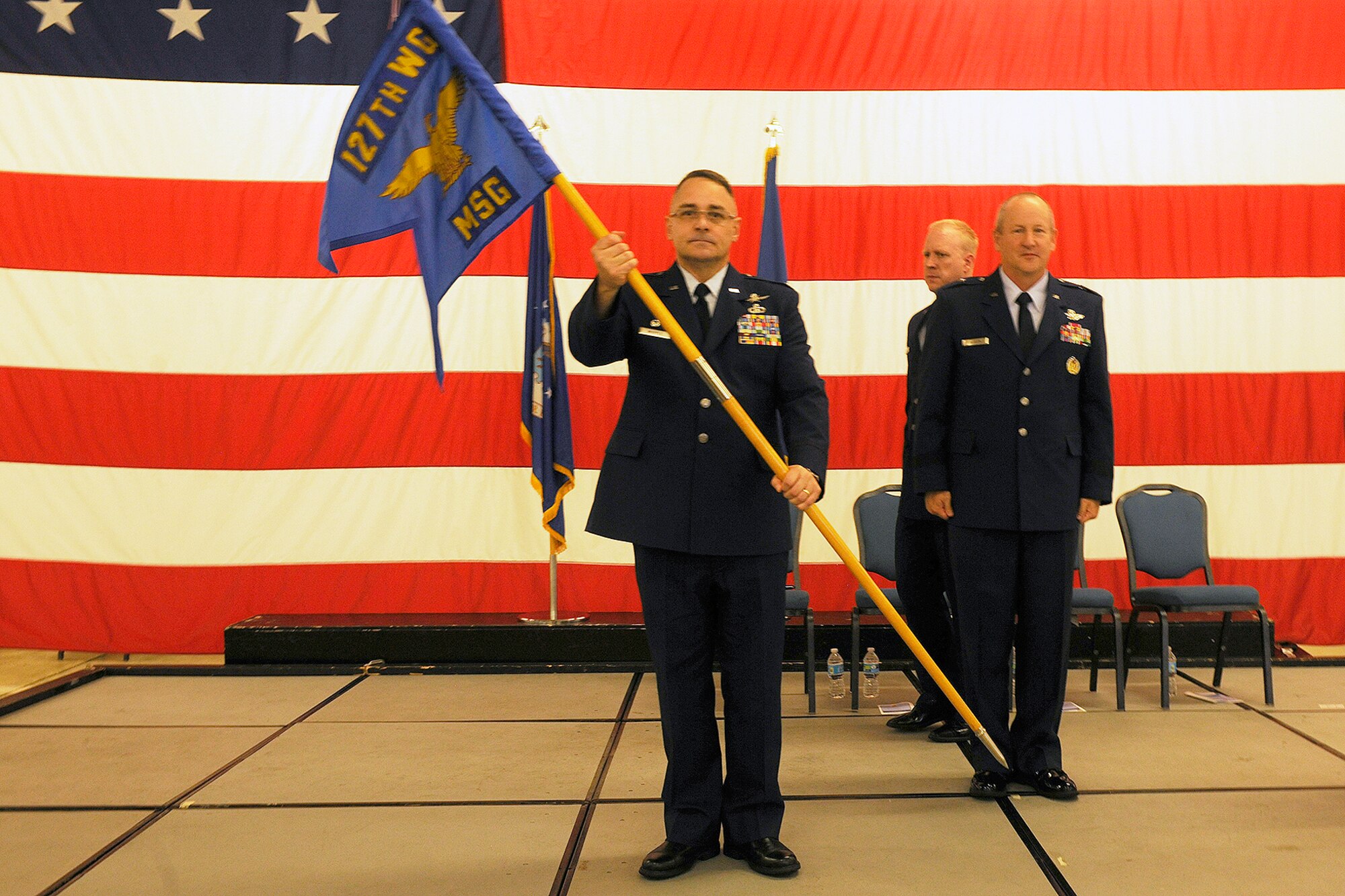 150614-Z-EZ686-011 -- Col. Daniel J. Whipple holds the guideon as he assumes command of the 127th Mission Support Group after a change of command ceremony at Selfridge Air National Guard Base, June 13, 2015. Whipple’s most recent assignment before assuming command of the 127th MSG was serving with the 217th Air Communications Squadron. (U.S. Air National Guard photo by MSgt. David Kujawa/released)
