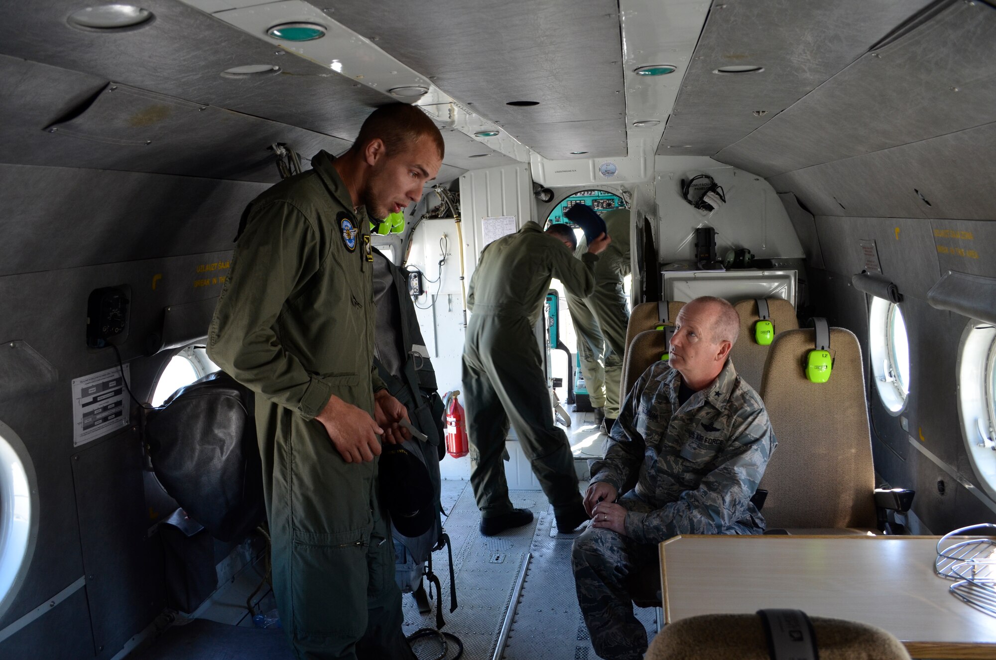 Brig. Gen. John D. Slocum, 127th Wing commander, Michigan Air National Guard, is given a safety briefing by a Latvian Air Force crew member on board a MI-17 helicopter at Lielvarde Air Base, Latvia, on June 12. Slocum is being transported to Rezekne to be a guest of honor in a Latvian National Guard change of command ceremony. The Michigan National Guard is part of a Department of Defense sponsored State Partnership Program between Michigan and the Latvian government that began in 1993 being one of the models for an ongoing program that has united 68 unique security partnerships involving 74 nations around the globe. The 127th Wing is participating in Saber Strike, an annual exercise that has brought 14 ally and partner nations together to increase interoperability between military forces. (U.S. Air National Guard photo by Capt. Anthony J. Lesterson)