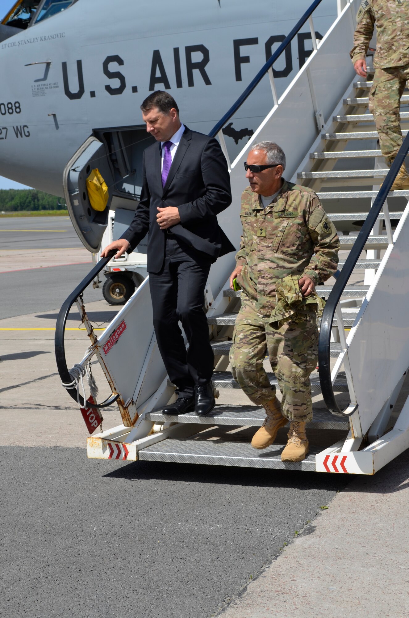 Maj. Gen. Gregory J. Vadnais, Adjutant General of the Michigan National Guard and newly elected Latvian President Raimods Veonis exit a 127th Wing, Michigan Air National Guard KC-135 Stratotanker after flight at the Riga International Airport, Latvia, during the Michigan and Latvian Partnership Day on June 10, 2015. The DOD sponsored State Partnership Program between Michigan and the Latvian government began in 1993 being one of the models for an ongoing program that has united 68 unique security partnerships involving 74 nations around the globe. Operation Saber Strike has brought 14 ally and partner nations together to increase interoperability between military forces. (U.S. Air National Guard photo by Capt. Anthony J. Lesterson)