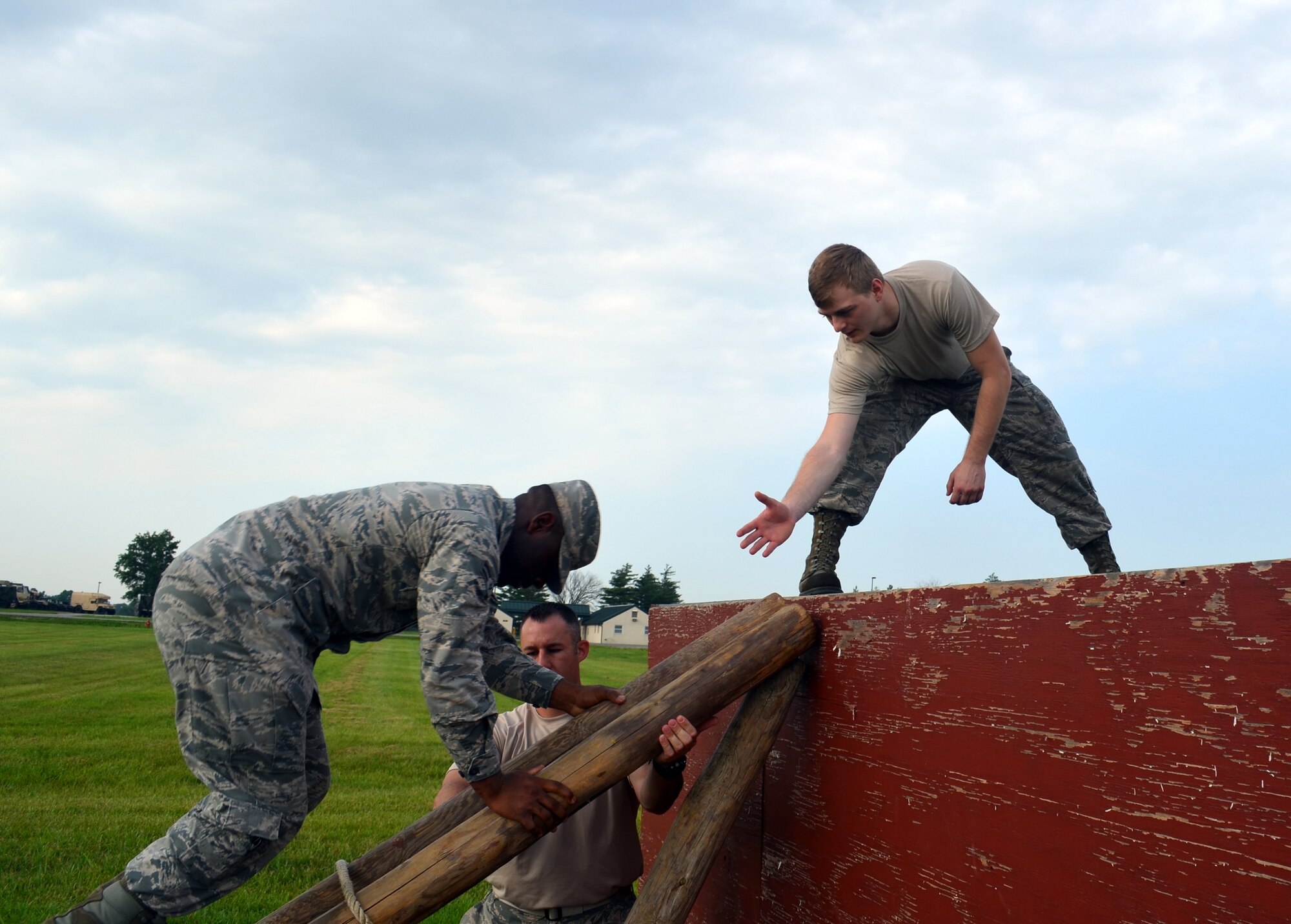 Citizen-Airmen of the 131st Bomb Wing complete a team-building obstacle on the confidence course at Camp Clark, Mo., in early June.  More than 150 Airmen trained for state emergency response during the two-week event.   (U.S. Air National Guard photo by 2nd Lt. Justin Clark)