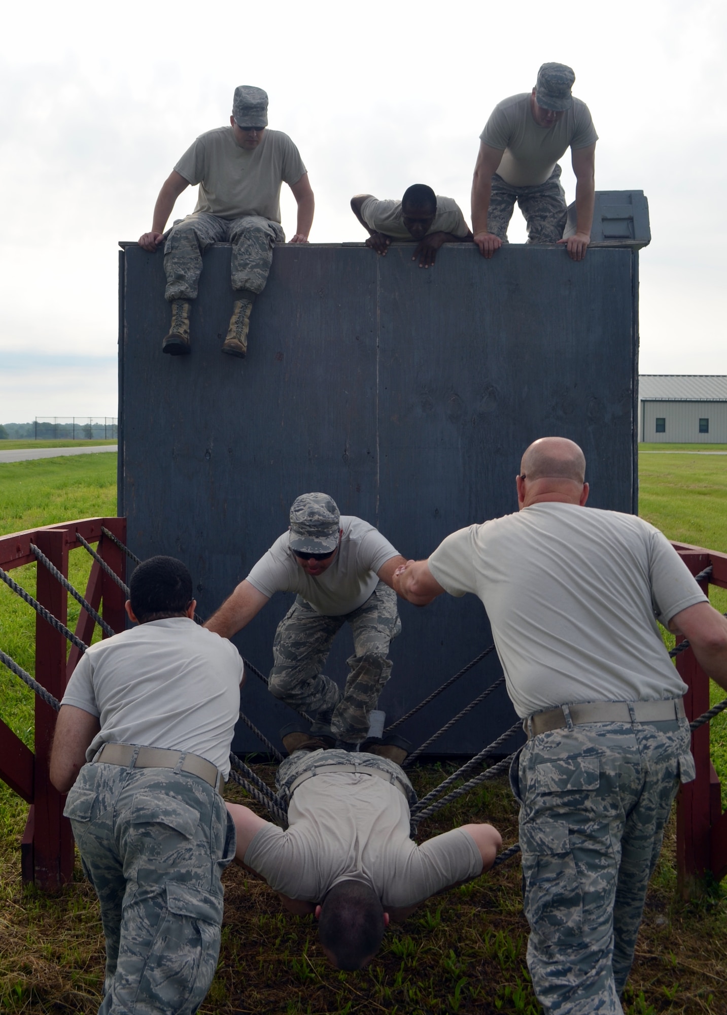 Citizen-Airmen of the 131st Bomb Wing complete a team-building obstacle on the confidence course at Camp Clark, Mo., in early June.  More than 150 Airmen trained for state emergency response during the two-week event.   (U.S. Air National Guard photo by 2nd Lt. Justin Clark)