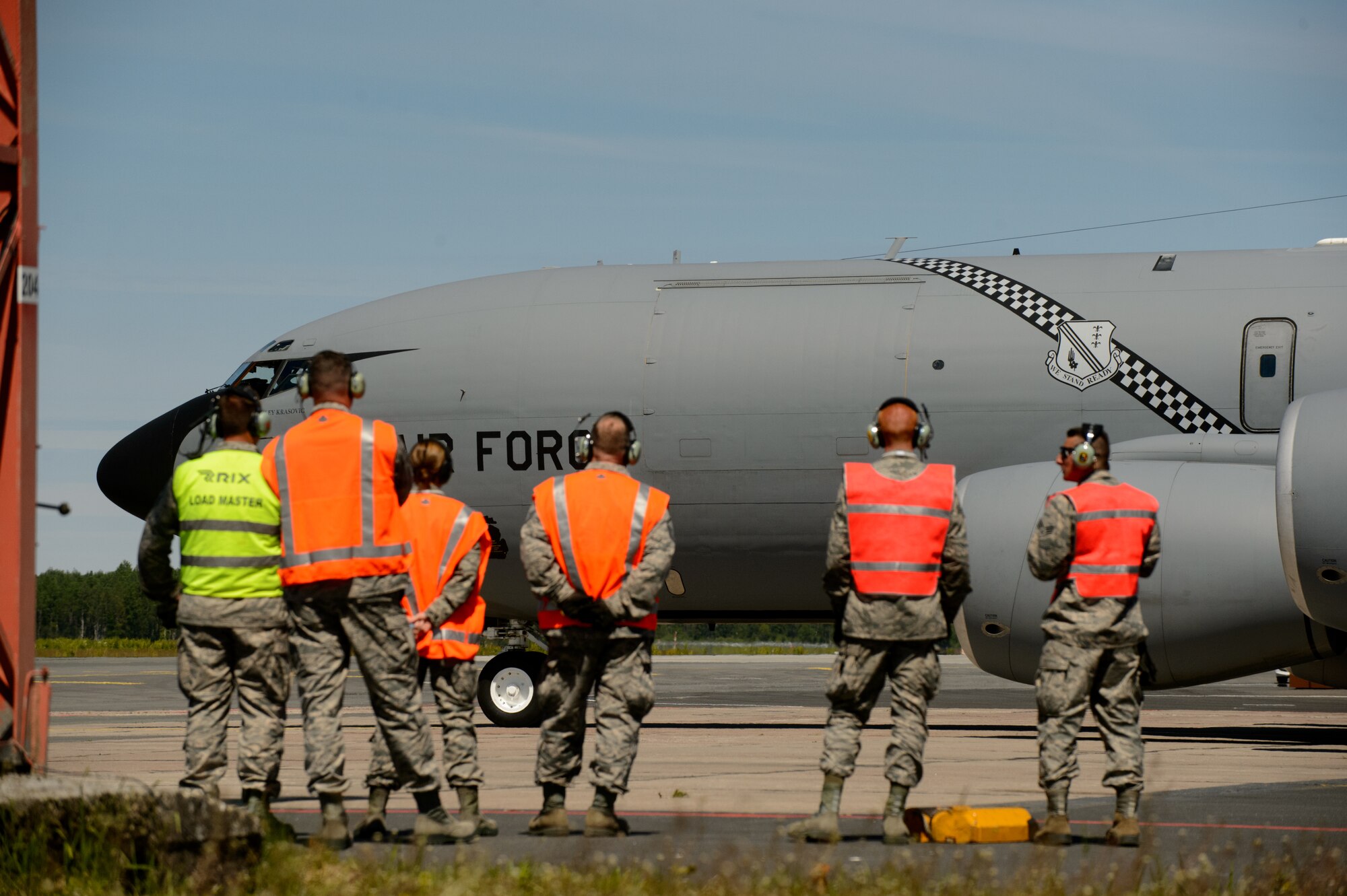 Airmen from the Pennsylvania and Michigan Air National Guard watch a KC-135 Stratotanker carrying the Latvian president elect and distinguished visitors departs for a sortie June 10, 2015, at Riga International Airport, Latvia. U.S. National Guardsmen hosted the Latvian president elect and several distinguished visitors during exercise Saber Strike 15. The visitors were able to view up-close how the Michigan and Pennsylvania Air National Guard conduct aerial-refueling and support ground troops by refueling a Maryland ANG A-10 Thunderbolt II. (U.S. Air Force photo/ Staff Sgt. Armando Schwier-Morales)