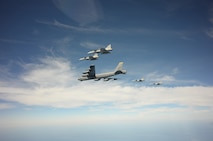 A U.S. Air Force B-52H Stratofortress leads a flight of four Swedish JAS-39 Gripens June 11, 2015, during a BALTOPS 2015 mission over the Baltic Sea. The aircraft took part in multiple missions throughout the exercise, including MK-62 Quick Strike mine drops and naval support functions. During this part of the exercise, the two airframes practiced aircraft intercepts and formation flights to hone skills between pilots from different countries. (Swedish Armed Forces courtesy photo)