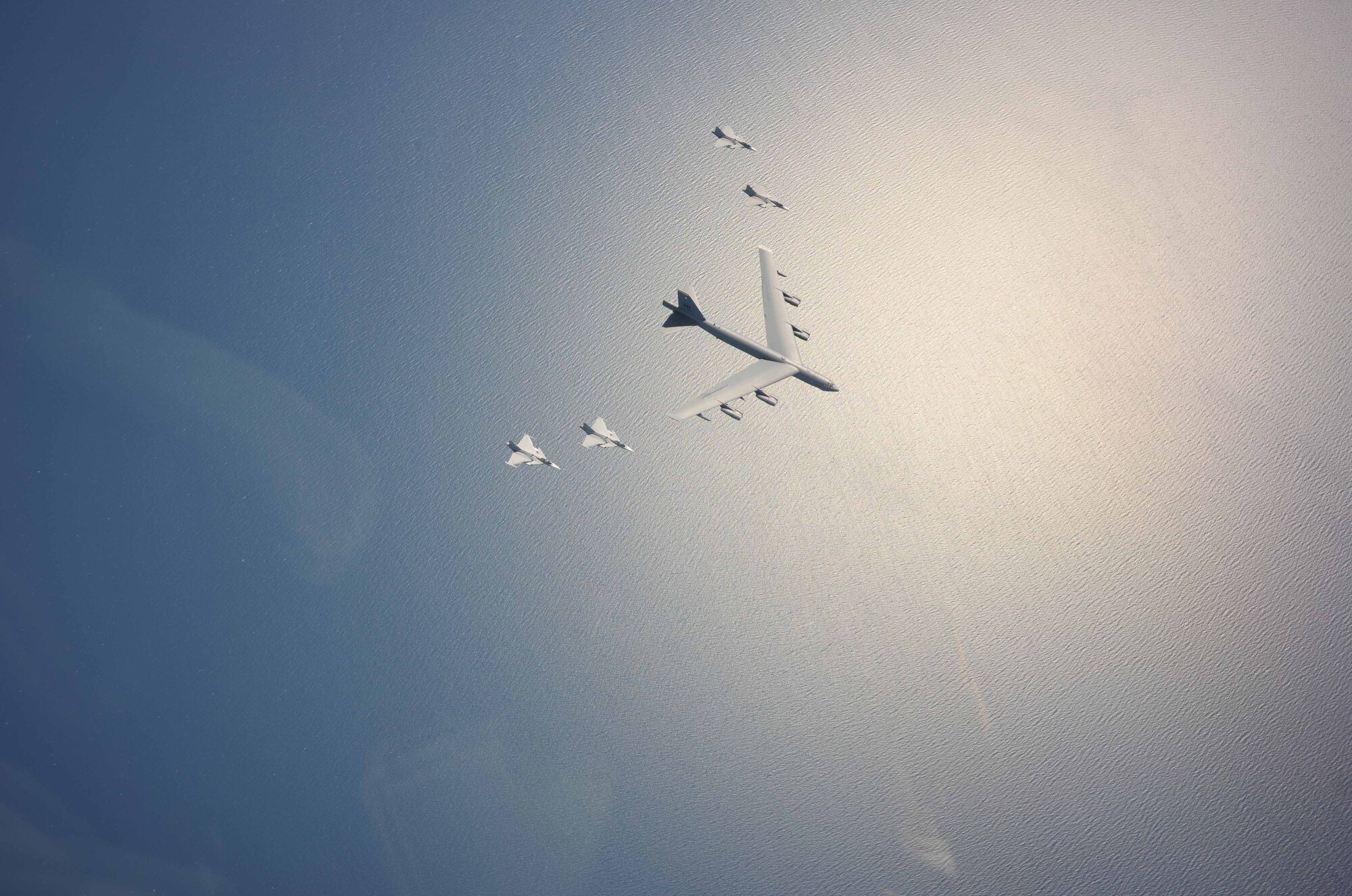 A U.S. Air Force B-52H Stratofortress leads a flight of four Swedish JAS-39 Gripens June 11, 2015, during a BALTOPS 2015 mission over the Baltic Sea. The aircraft took part in multiple missions throughout the exercise, including MK-62 Quick Strike mine drops and naval support functions. During this part of the exercise, the two airframes practiced aircraft intercepts and formation flights to hone skills between pilots from different countries. (Swedish Armed Forces courtesy photo)