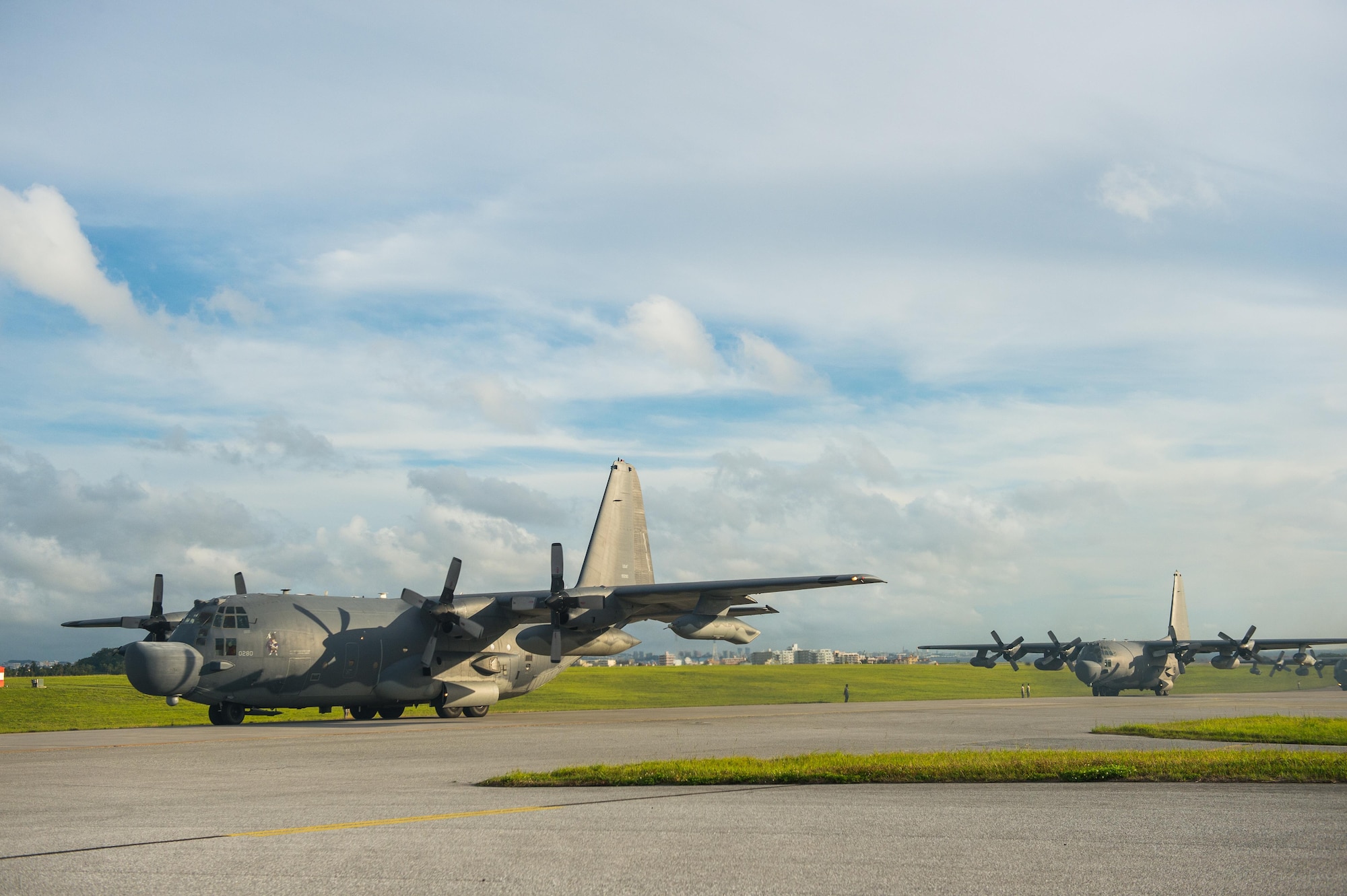 Two U.S. Air Force MC-130H Combat Talon IIs from the 1st Special Operations Squadron taxi in line on the Kadena Air Base, Japan, flightline May 14, 2015. The 1st Special Operations Squadron operates the MC-130H providing infiltration, exfiltration, and resupply of special operations forces and equipment in hostile or denied territory.  By conducting formation flight, aircrews and maintainers test and validate their ability to efficiently generate aircraft and to quickly infiltrate and exfiltrate large numbers of ground forces.   (U.S. Air Force photo by Airman 1st Class Tyler Woodward)