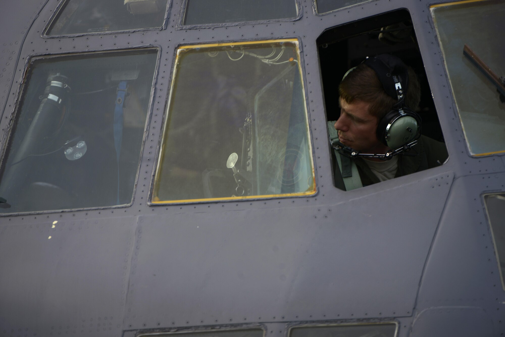 U.S. Air Force Lt. Col. David Lucas, an MC-130H Combat Talon II pilot and the director of operations at the 1st Special Operations Squadron, looks out the window of a 1st SOS MC-130H Combat Talon II before takeoff on the Kadena Air Base, Japan, flight line May 14, 2015. The 1st Special Operations Squadron is one of five squadrons that make up the 353rd Special Operations Group.  As the only Air Force special operations group in the Pacific, they are the focal point for Air Force special operations activities throughout the United States Pacific Command Theater. (U.S. Air Force photo by Staff Sgt. Maeson L. Elleman)