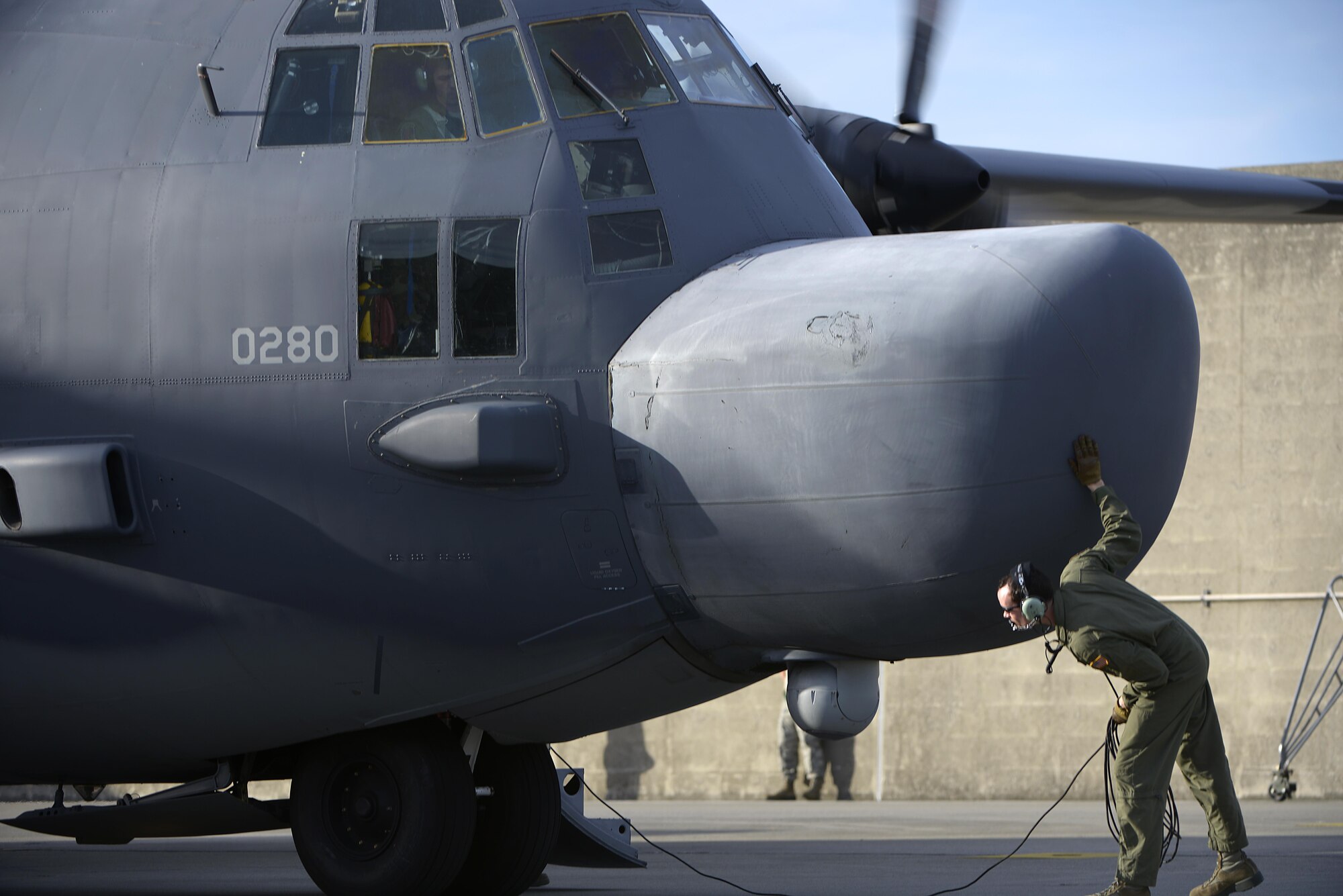 U.S. Air Force Staff Sgt. Daniel Sterns, a loadmaster from the 1st Special Operations Squadron performs pre-flight checks for a 1st SOS MC-130H Combat Talon II before a formation flight on Kadena Air Base, Japan, May 14, 2015. The 1st Special Operations Squadron operates the MC-130H providing infiltration, exfiltration, and resupply of special operations forces and equipment in hostile or denied territory.  By conducting formation flight, aircrews and maintainers test and validate their ability to efficiently generate aircraft and to quickly infiltrate and exfiltrate large numbers of ground forces.  (U.S. Air Force photo by Staff Sgt. Maeson L. Elleman)