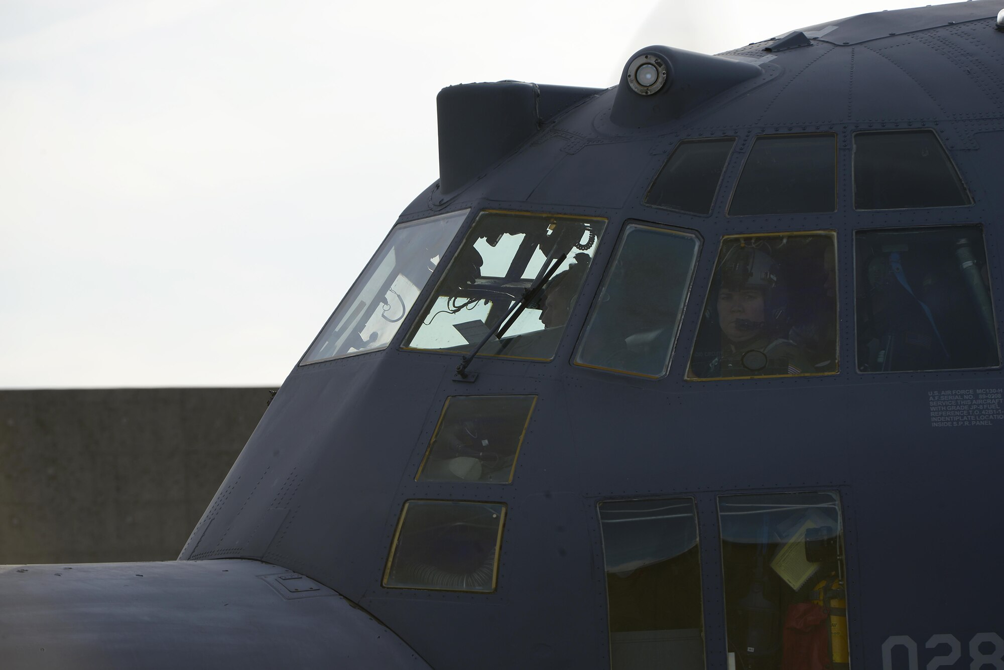 U.S. Air Force Capt. Valerie Knight, an MC-130H Combat Talon II pilot from the 1st Special Operations Squadron looks out her window before takeoff for a formation flight on Kadena Air Base, Japan, May 14, 2015. The 1st Special Operations Squadron is one of five squadrons that make up the 353rd Special Operations Group.  As the only Air Force special operations group in the Pacific, they are the focal point for Air Force special operations activities throughout the United States Pacific Command Theater. (U.S. Air Force photo by Staff Sgt. Maeson L. Elleman)