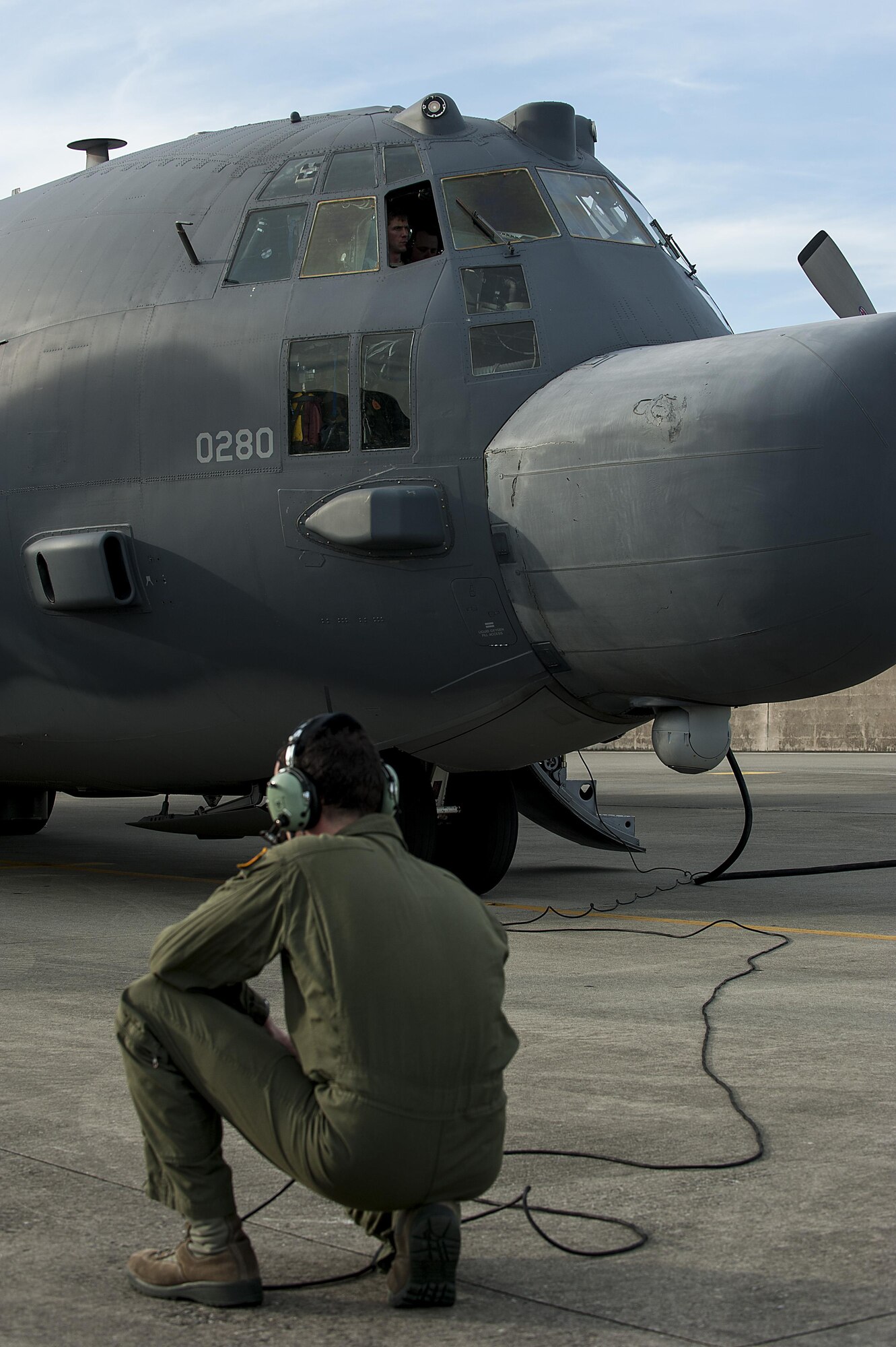 U.S. Air Force Staff Sgt. Daniel Sterns, an MC-130H Combat Talon II loadmaster from the 1st Special Operations Squadron watches as the pilot start the aircraft’s engines before takeoff on the Kadena Air Base, Japan, flightline May 14, 2015.  The 1st Special Operations Squadron is one of five squadrons that make up the 353rd Special Operations Group.  As the only Air Force special operations group in the Pacific, they are the focal point for Air Force special operations activities throughout the United States Pacific Command Theater.  (U.S. Air Force photo by Senior Airman Stephen G. Eigel)