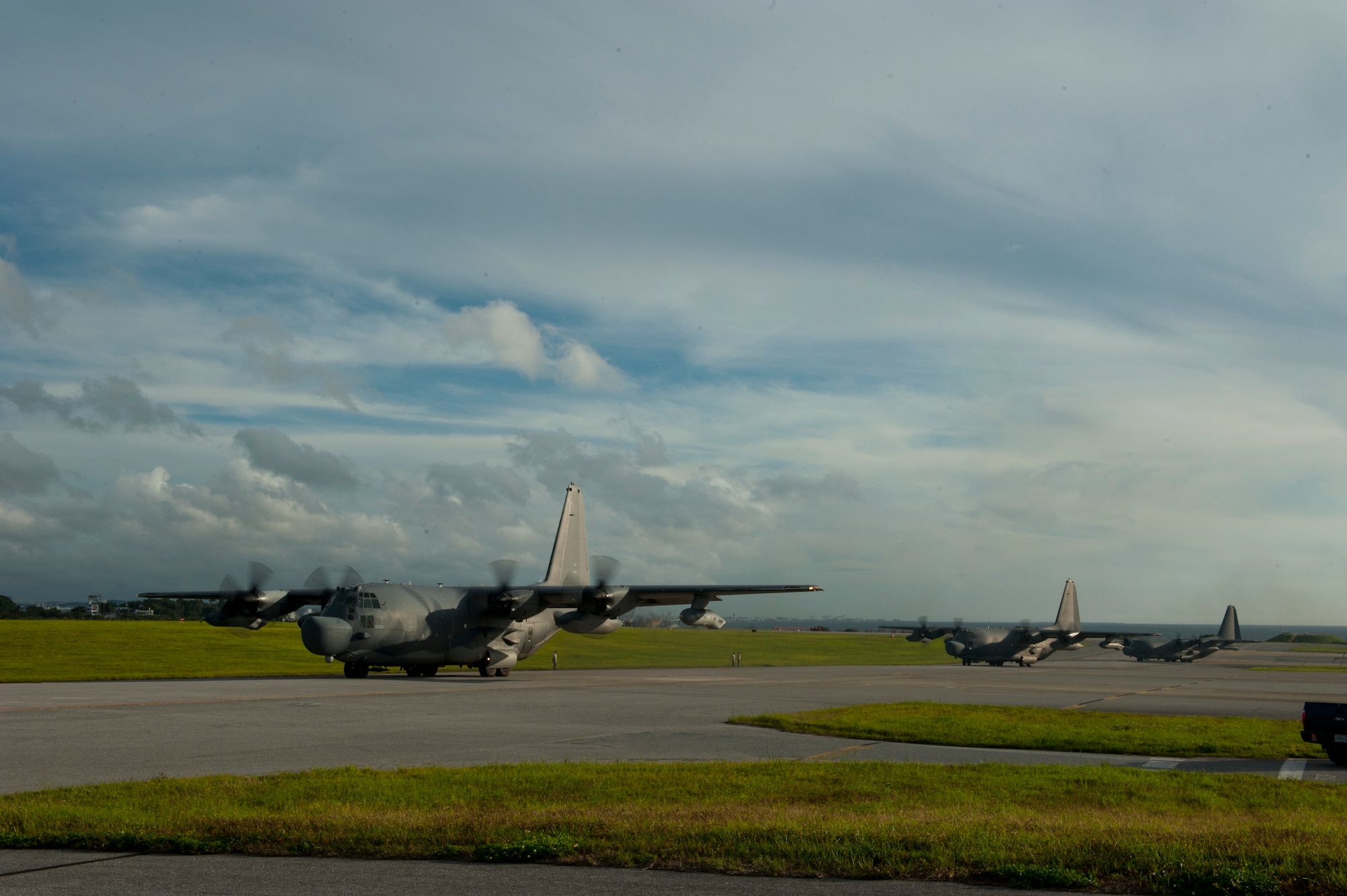 Three U.S. Air Force MC-130H Combat Talon IIs from the 1st Special Operations Squadron taxi in line on the Kadena Air Base, Japan, flightline May 14, 2015. The 1st Special Operations Squadron operates the MC-130H providing infiltration, exfiltration, and resupply of special operations forces and equipment in hostile or denied territory.  By conducting formation flight, aircrews and maintainers test and validate their ability to efficiently generate aircraft and to quickly infiltrate and exfiltrate large numbers of ground forces. (U.S. Air Force photo by Senior Airman Stephen G. Eigel)