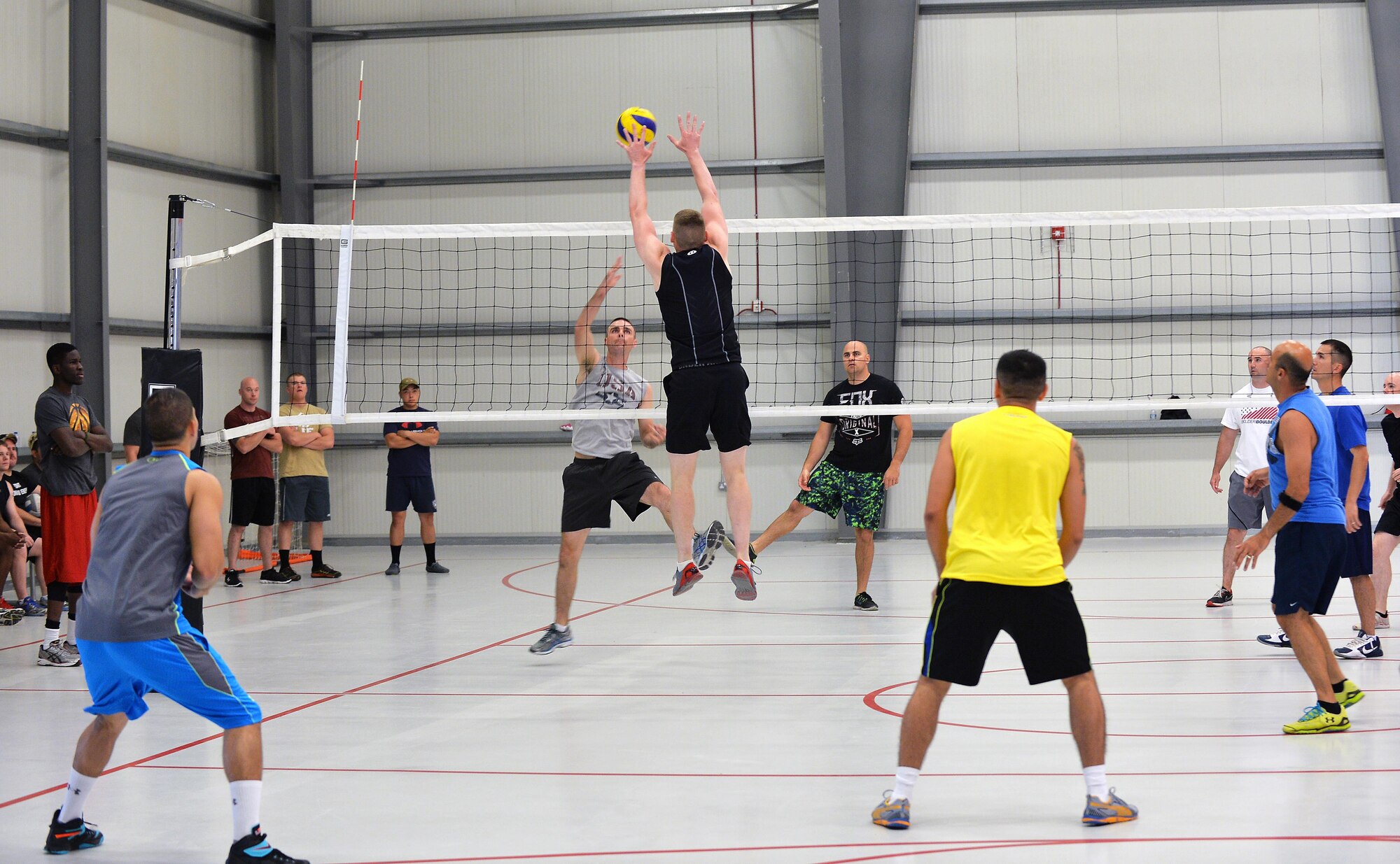 Volleyball players go head-to-head during a tournament at an undisclosed location in Southwest Asia June 13, 2015. The teams, who were made up of U.S. Soldiers and Airmen as well as other coalition forces, participated in five sports, including this one, to help celebrate the U.S. Army’s 240th birthday. (U.S. Air Force photo/Tech. Sgt. Jeff Andrejcik)  