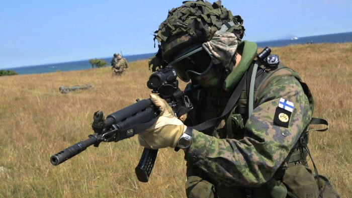 An international Corps of Marines from Sweden, Finland, and the U.K. conduct amphibious assaults on a beachhead in Ravlunda, Sweden, for local media outlets during BALTOPS 2015, June 13. The amphibious forces are part of 17 NATO Allies and partner nations that are integrated in air, land, and sea operations to improve their combined-force capability to work together and to respond to threats in the Baltic region.