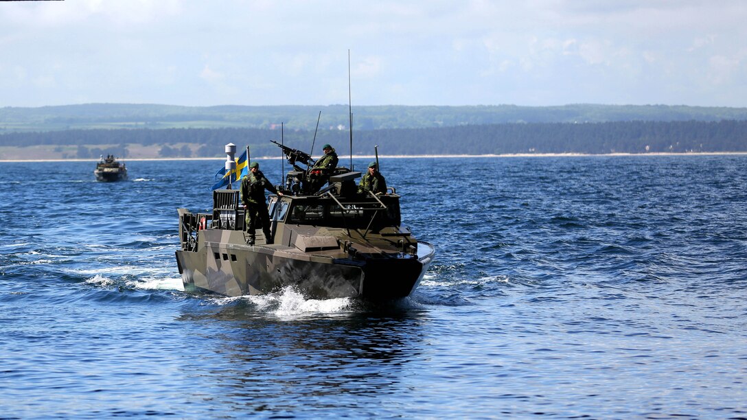 A Swedish amphibious assault vehicle approaches the Polish Battleship participating in BALTOPS 2015, June 9. BALTOPS is an annual, multinational exercise designed to enhance the operational familiarity of NATO Allies and partner nations and demonstrate the capabilities to defend the Baltic region.