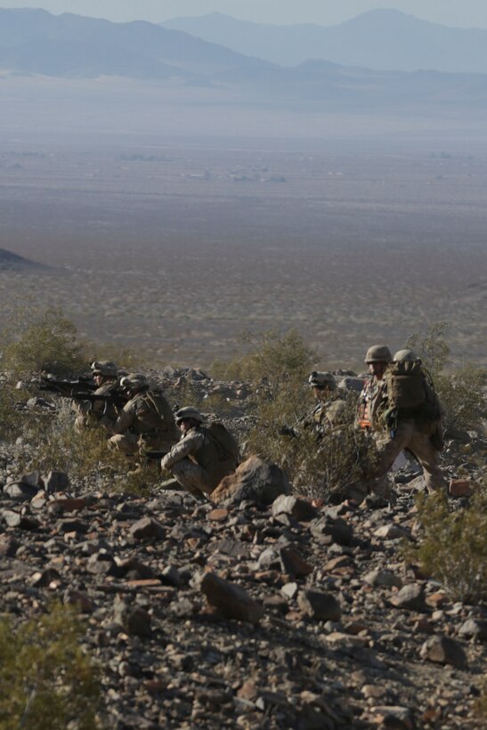 Marines with 3rd Platoon, Lima Company, 3rd Battalion, 25th Marines Regiment, 4th Marine Division, Marine Forces Reserve lay down a line of fire during the 2015 Integrated Training Exercise at Twentynine Palms, Calif., June 12, 2015. ITX allows Reserve Marines the opportunity to train in realistic environments and conditions, ensuring the highest levels of proficiency and readiness for worldwide deployment.