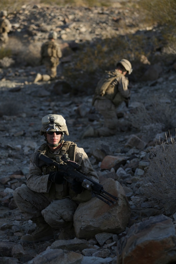 Marines with 3rd Platoon, Lima Company, 3rd Battalion, 25th Marines Regiment, 4th Marine Division, Marine Forces Reserve, secure the perimeter and watch for enemy fire during the 2015 Integrated Training Exercise at Twentynine Palms, Calif., June 12, 2015. At ITX, Marines learn to work in environments that simulate combat in order to be prepared for future deployment.