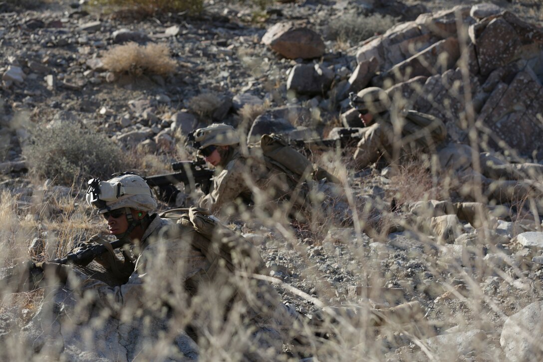Marines with 3rd Platoon, Lima Company, 3rd Battalion, 25th Marines Regiment, 4th Marine Division, Marine Forces Reserve, patrol the area evading enemy fire during the 2015 Integrated Training Exercise at Twentynine Palms, Calif., June 12, 2015. At ITX, Marines must overcome stressors that would be present in a combat situation or on deployment.