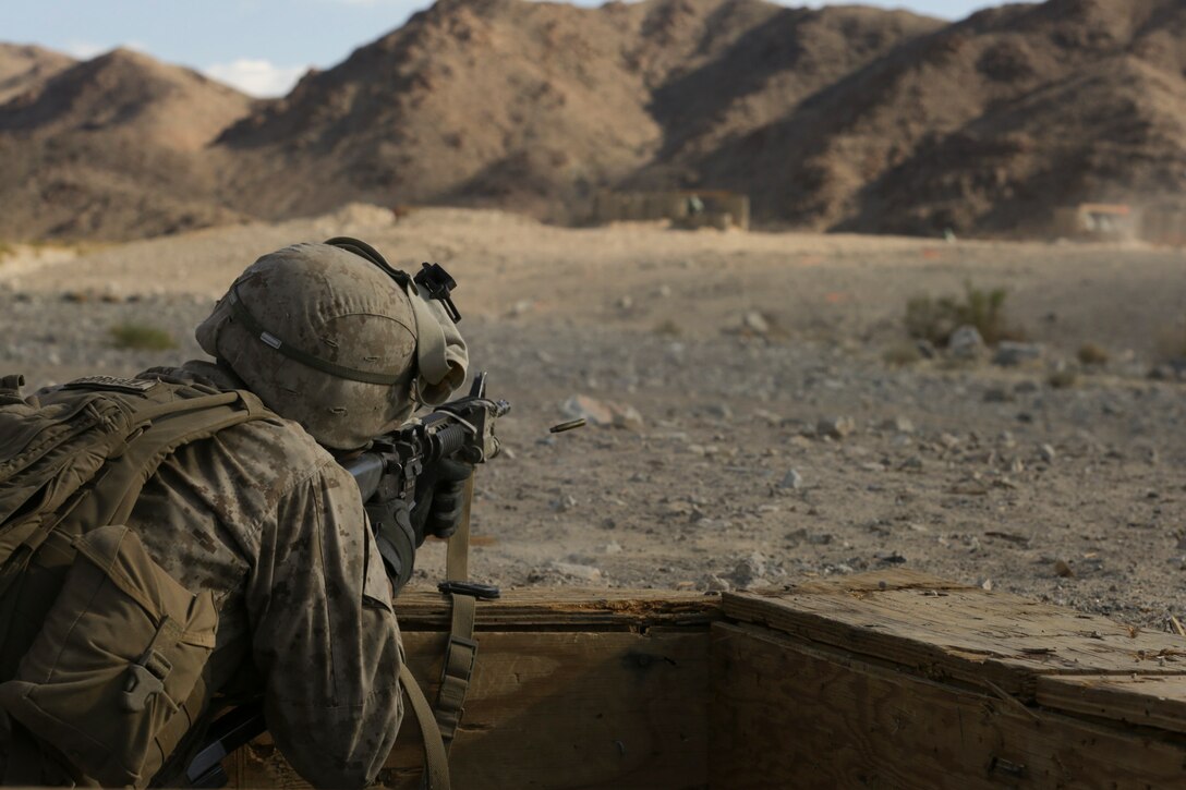 Lance Cpl. Cody McMillian, Team Leader, 3rd Squad, 3rd Platoon, Lima Company,3rd Battalion 25th Regiment, 4th Marine Division, Marine Forces Reserve shoots down range during the 2015 Integrated Training Exercise at Twentynine Palms, Calif., June 12, 2015. ITX allows Reserve Marines the opportunity to train in realistic environments and conditions, ensuring the highest levels of proficiency and readiness for worldwide deployment.