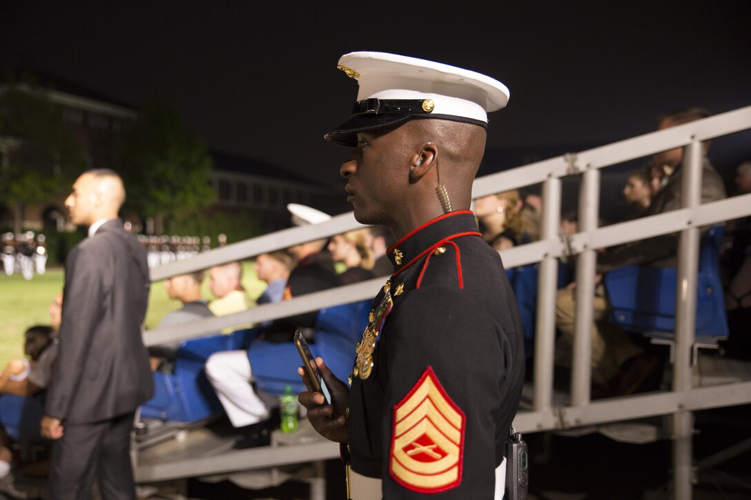 Gunnery Sgt. Cedric Smith, the drill master for Marine Barracks Washington D.C., observes the Evening Parade, June 12, 2015.(Official Marine Corps photo by Cpl. Chi Nguyen/Released)