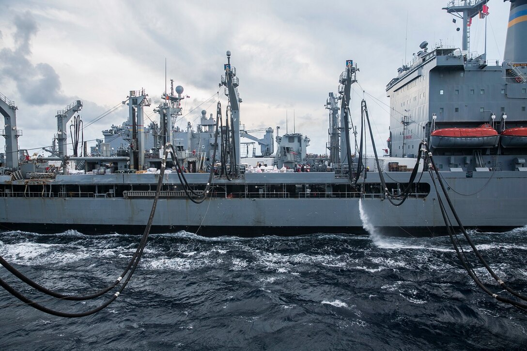 The USS Essex (LHD 2) is refueled by the USNS Walter S. Diehl (T-AO 193) during a replenishment-at-sea in the South China Sea June 14, 2015. The USS Essex receives fuel and stores at sea in order to continue its mission without stopping forward progress as they transition to their 5th Fleet area of responsibility. (U.S. Marine Corps photo by Cpl. Anna Albrecht/Released)