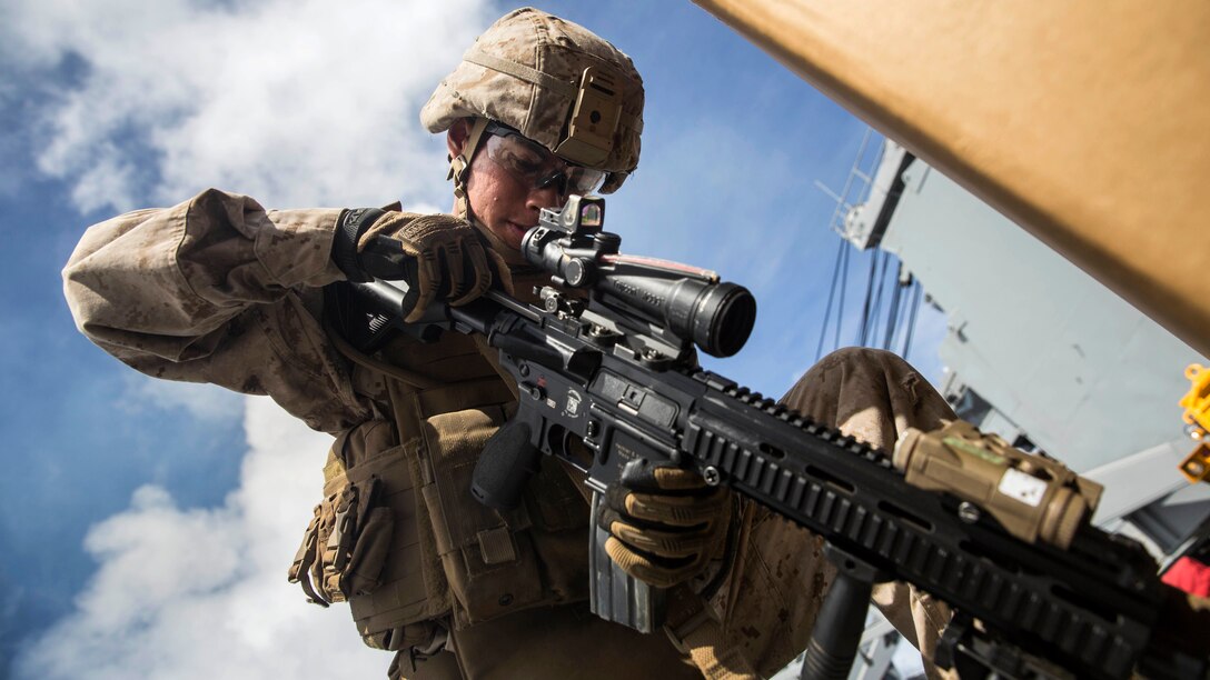 U.S. Marine Lance Cpl. Jose Garcia practices immediate-action drills aboard USS Rushmore at sea in the Pacific Ocean, June 1, 2015. Garcia is a rifleman with Kilo Company, Battalion Landing Team 3rd Battalion, 1st Marine Regiment, 15th Marine Expeditionary Unit. BLT 3/1 constantly trains for the unknown in order to respond to the needs of the MEU while deployed. These drills keep the Marines in a constant state of combat readiness while at sea.