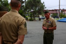 Major General Lawrence D. Nicholson, the commanding general of the 1st Marine Division, congratulates Marines chosen from the division for the new Squad Leader Development Program, aboard Marine Corps Base Camp Pendleton, Calif., June 12, 2015. The program will allow qualified Marines to develop a career path as an infantry squad leader.
