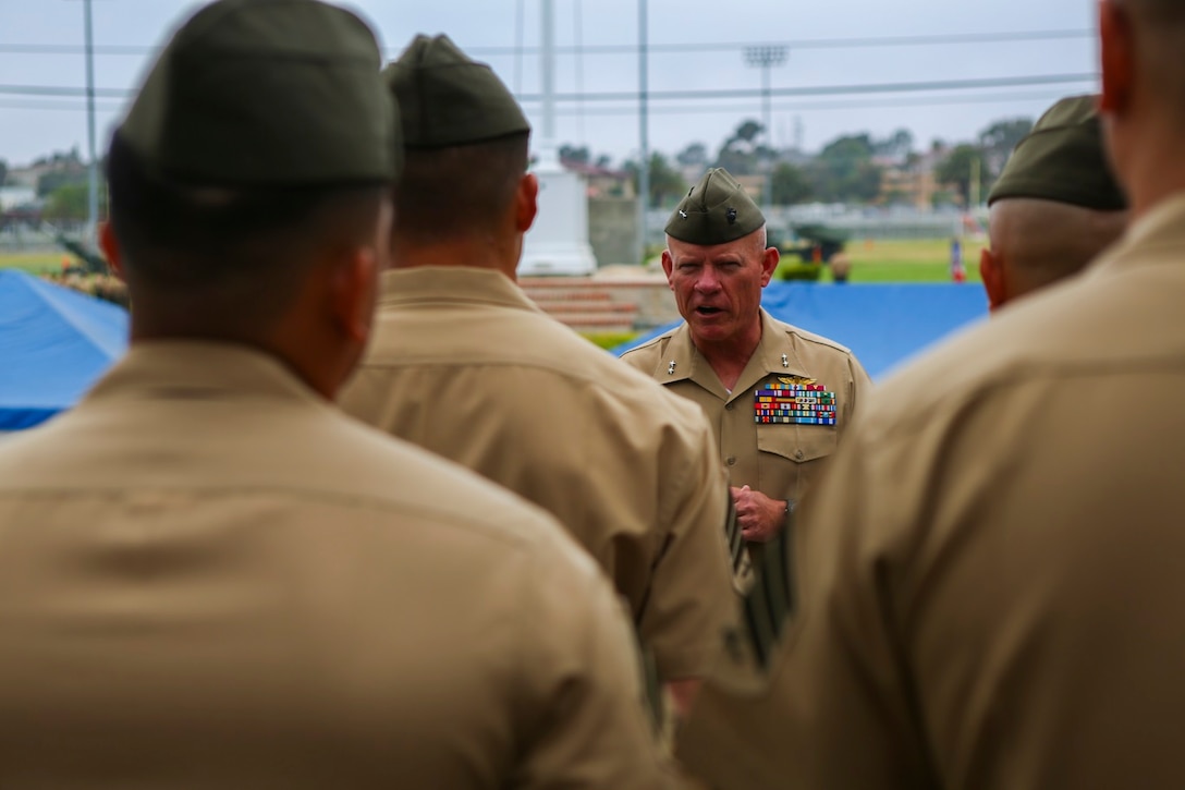 Major General Lawrence D. Nicholson, the commanding general of the 1st Marine Division, congratulates Marines chosen from the division to attend the new Squad Leader Development Program, aboard Marine Corps Base Camp Pendleton, Calif., June 12, 2015. The program will allow qualified Marines to develop a career path as an infantry squad leader.