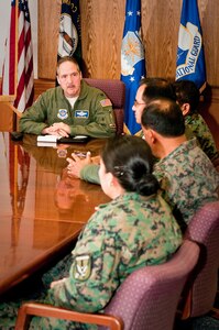 Air Force Col. Greg Nelson, commander of the Kentucky National Guard's 123rd Airlift Wing, meets with members of the Ecuadorian Air Force during a tour of the Kentucky Air National Guard Base in Louisville, Ky, on March 1, 2011. The Ecuadorians were visiting as part of the National Guard Bureau's State Partnership Program, which fosters stronger relations between the United States and foreign governments by promoting bilateral military cooperation. Ecuador and the Kentucky National Guard have been partners since 1997.