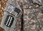 Army Staff Sgt. Timothy Liptrap, a cannon crew member, assigned to 1/201st Field Artillery, West Virginia Army National Guard, wears his combat patch from Desert Storm when he served under A Battery, 4th Battalion, 41st Field Artillery of the 197th Infantry Brigade.