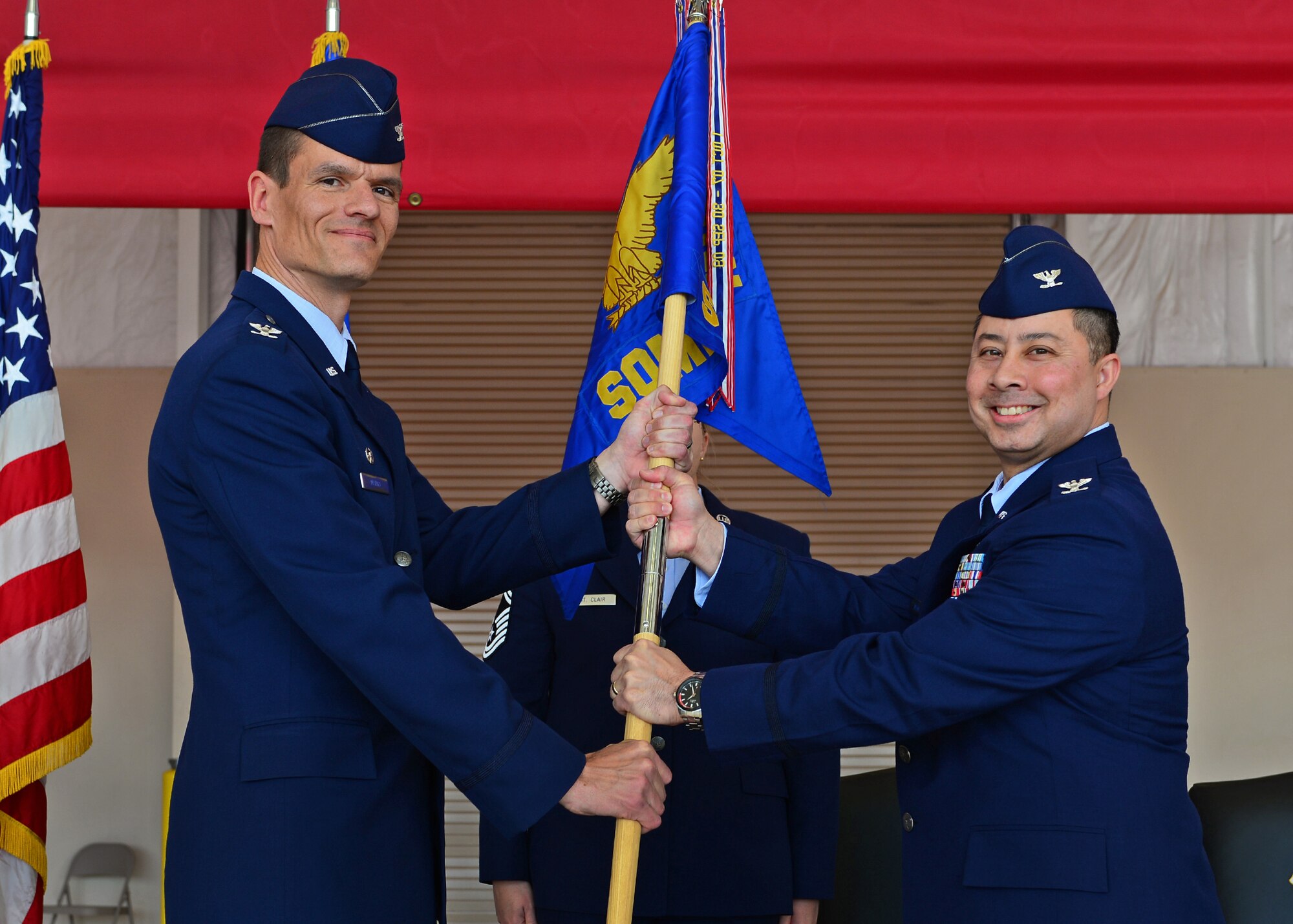 U.S. Air Force Col. John Mammano, 27th Special Operations Medical Group, receives the guideon and assumes command during the 27th SOMDG change of command ceremony May 29, 2015 at Cannon Air Force Base, N.M. Mammano will help provide medical care to Air Commandos of the 27th SOW, and a total beneficiary population of 13,500 in the northeastern region of New Mexico and the panhandle of northern Texas. (U.S. Air Force photo/Senior Airman Eboni Reece)  