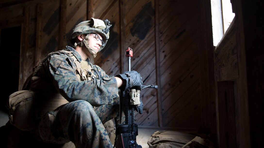 A Marine with Bravo Company, 1st Battalion, 8th Marine Regiment, provides watch during a military operations on urban terrain exercise at Marine Corps Base Camp Lejeune, N.C., June 11, 2015. Safely practicing transitions in an urban combat environment increased Marines’ confidence and better prepared them for a combat situation.