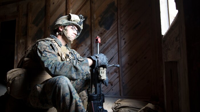 A Marine with Bravo Company, 1st Battalion, 8th Marine Regiment, provides watch during a military operations on urban terrain exercise at Marine Corps Base Camp Lejeune, N.C., June 11, 2015. Safely practicing transitions in an urban combat environment increased Marines’ confidence and better prepared them for a combat situation.