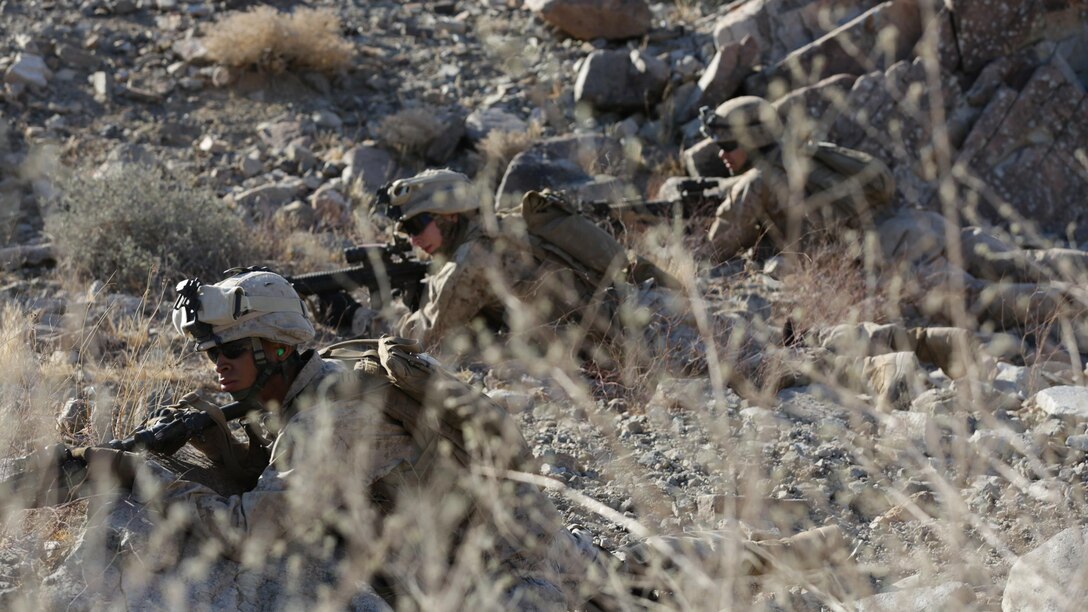 Marines with 3rd Platoon, Lima Company, 3rd Battalion, 25th Marines Regiment, 4th Marine Division, Marine Forces Reserve, patrol the area evading enemy fire during the 2015 Integrated Training Exercise at Twentynine Palms, Calif., June 12, 2015. At ITX, Marines must overcome stressors that would be present in a combat situation or on deployment.