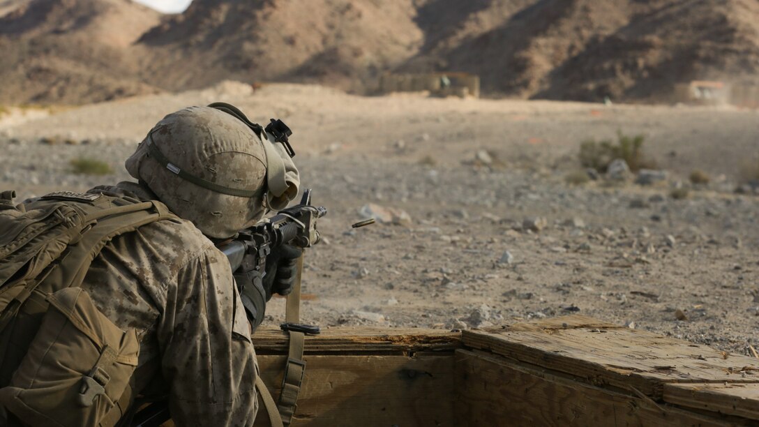 Lance Cpl. Cody McMillian, Team Leader, 3rd Squad, 3rd Platoon, Lima Company,3rd Battalion 25th Regiment, 4th Marine Division, Marine Forces Reserve shoots down range during the 2015 Integrated Training Exercise at Twentynine Palms, Calif., June 12, 2015. ITX allows Reserve Marines the opportunity to train in realistic environments and conditions, ensuring the highest levels of proficiency and readiness for worldwide deployment.