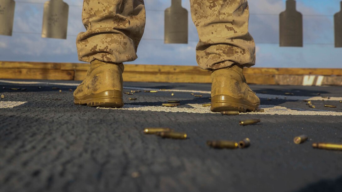 A U.S. Marine participates in a combat marksmanship program range on the flight deck of the USS Ashland June 12, 2015. The Marines honed their skills by executing different shooting drills. The Marines are with Echo Company, Battalion Landing Team 2nd Battalion, 5th Marines, 31st Marine Expeditionary. The 31st MEU is currently deployed on the regularly scheduled Fall Patrol of the Asia-Pacific region 