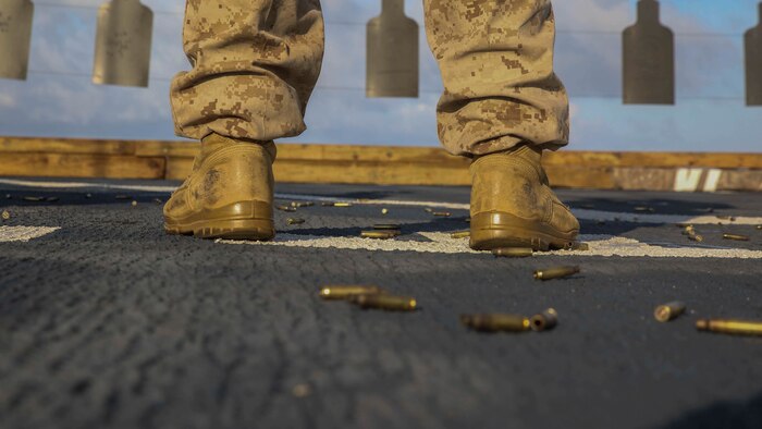 A U.S. Marine participates in a combat marksmanship program range on the flight deck of the USS Ashland June 12, 2015. The Marines honed their skills by executing different shooting drills. The Marines are with Echo Company, Battalion Landing Team 2nd Battalion, 5th Marines, 31st Marine Expeditionary. The 31st MEU is currently deployed on the regularly scheduled Fall Patrol of the Asia-Pacific region 