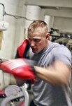Army Pfc. Scott Suhr, an Iowa Army National Guardsman with Company B, 1st
Battalion, 133rd Infantry Regiment, 2nd Brigade Combat Team, 34th Infantry
Division, works on his punches with help from Army Pfc. Richard Reichardt,
left, infantryman with Company B, at Forward Operating Base Torkham Gate's
gym March 10, 2011. Suhr, who fought for the welterweight title in the
Mainstream Mixed Martial Arts circuit in Iowa, is not losing sight of his
professional fighting aspirations during his year-long deployment to
Afghanistan. 