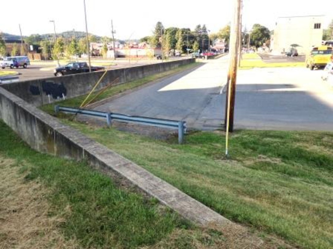 A concrete floodwall transitions from a section of levee in the Bull Run Flood Risk Management Project in Loyalsock, Pennsylvania. Floodwalls are used when property space is tight.

