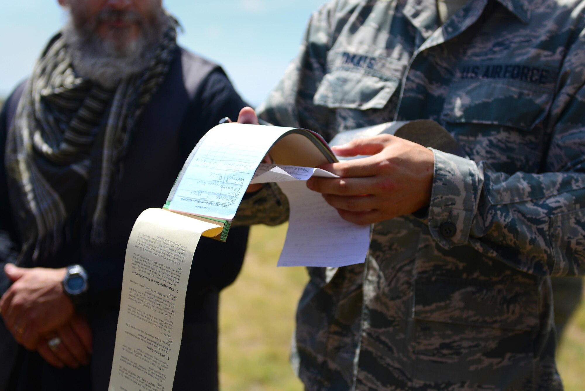 U.S. Air Force Airman 1st Class John Takats, 27th Special Operations Contracting Squadron, looks over a receipt during an exercise June 9, 2015 at Melrose Air Force Range, N.M. During the exercise, finance and contracting Air Commandos received financial training and practiced managing contracts and contract personnel in a contingency environment.  (U.S. Air Force photo/Senior Airman Eboni Reece)