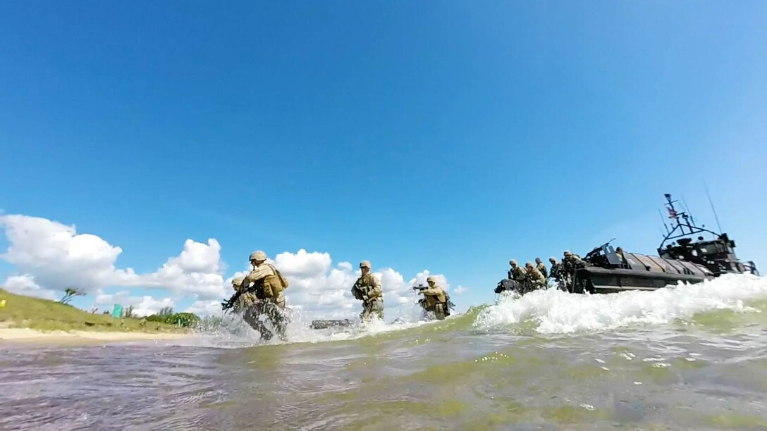 NATO Allied Marines from the U.K., U.S., Sweden, and Finland simulate amphibious assaults on a Swedish beachhead during BALTOPS 2015, June 10. The 17 Allied and partner countries will integrate their air, land, and sea operations and procedures to demonstrate the combined-forces capability to respond to threats in the Baltic region.