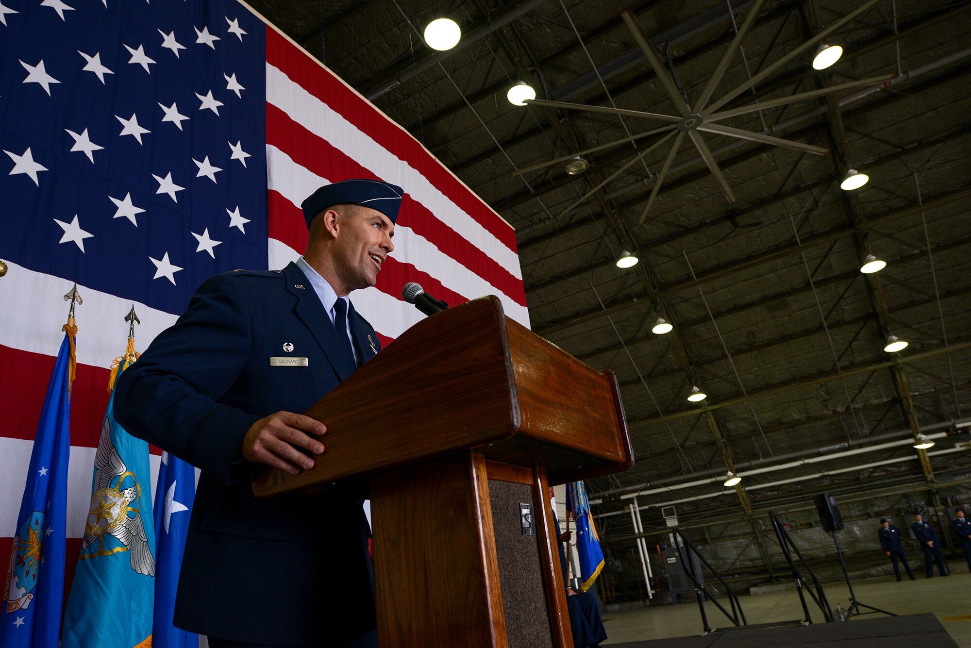 Col. Brook Leonard, outgoing 51st Fighter Wing commander, speaks to the audience at the 51st FW change of command ceremony June 16, 2015, at Osan Air Base, Republic of Korea. Leonard reflected on his two-year tour at Osan, and said teamwork is the only way for Airmen in the U.S. and ROK to continue to improve. (U.S. Air Force photo by Staff Sgt. Jake Barreiro/Released)