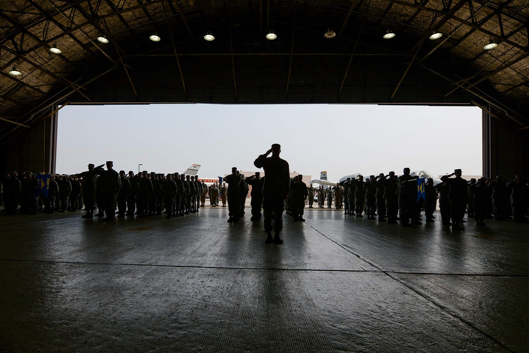 The 51st Fighter Wing stands in formation at the 51st FW change of command ceremony June 16, 2015, at Osan Air Base, Republic of Korea. The event signified the transfer of authority in the 66-year-old fighter wing. (U.S. Air Force photo by Staff Sgt. Jake Barreiro/Released)