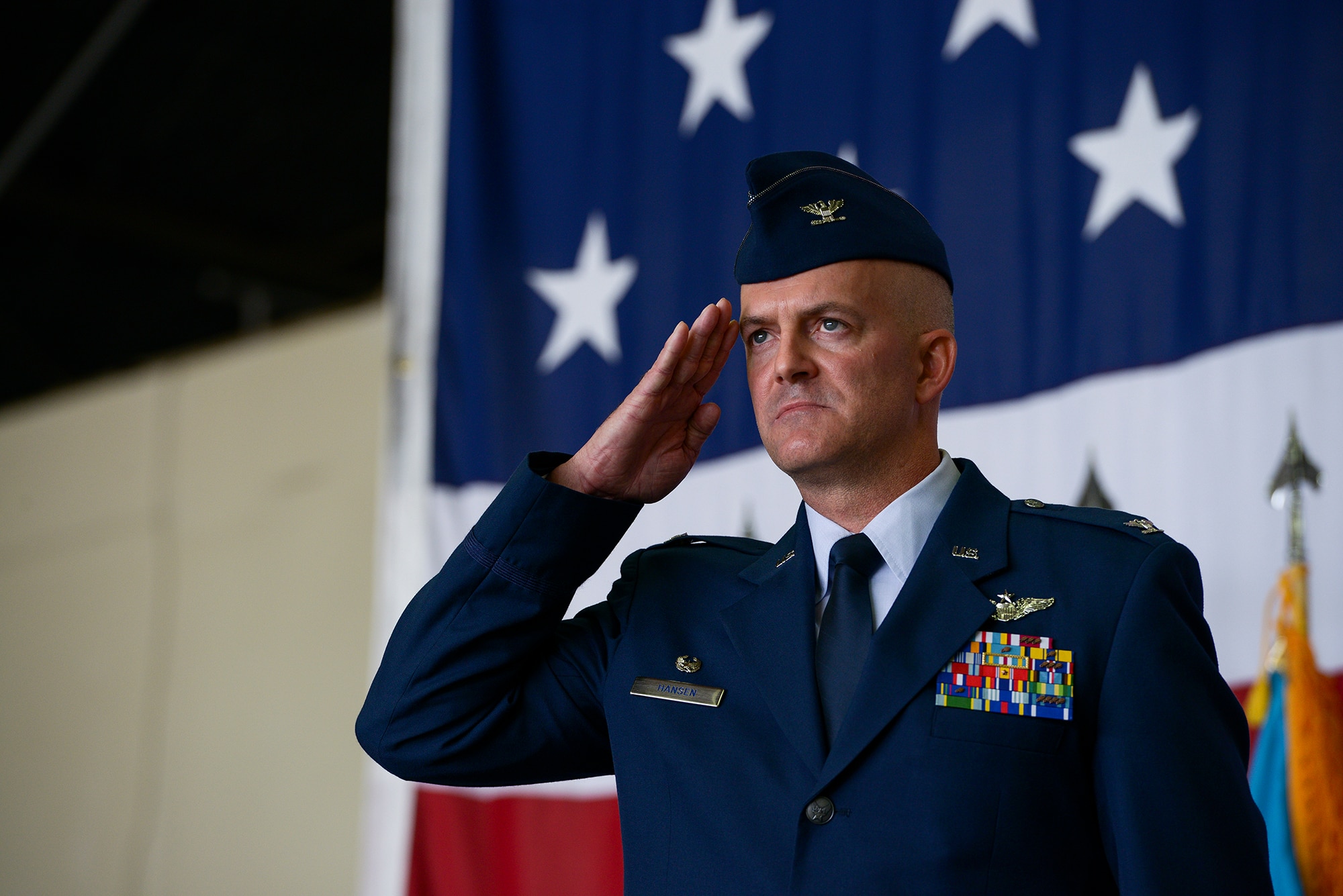 Col. Andrew Hansen, incoming 51st Fighter Wing commander, salutes the formation during the 51st FW change of command ceremony June 16, 2015, at Osan Air Base, Republic of Korea. Hansen is the 63rd commander in the wing's history. (U.S. Air Force photo by Staff Sgt. Jake Barreiro/Released)
