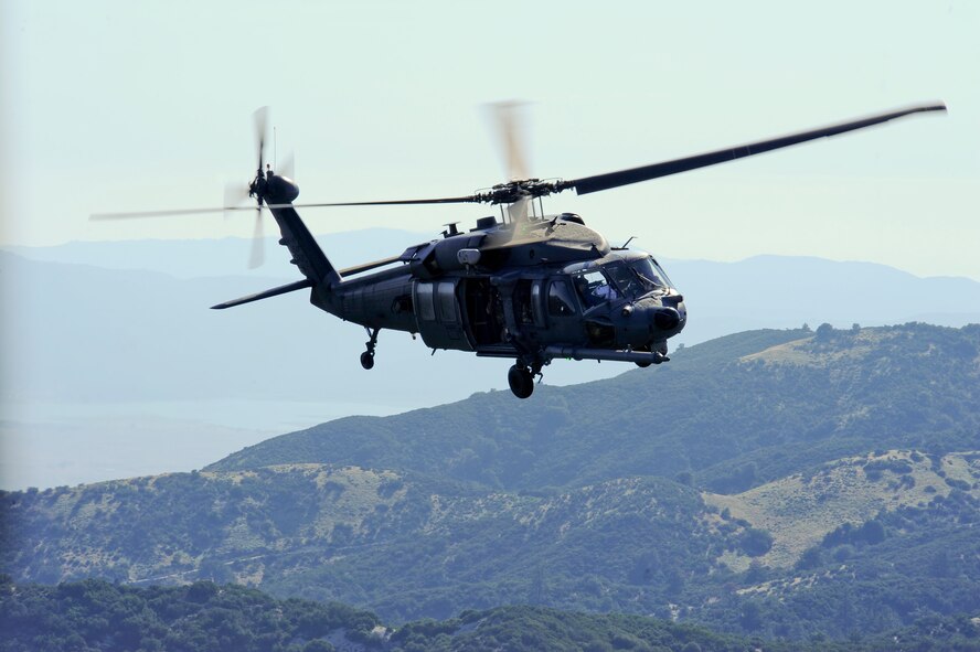 A U.S. Air Force HH-60G Pave Hawk from the 66th Rescue Squadron flies over Southern California during Angel Thunder 2015, June 11, 2015. Angel Thunder is the largest personnel recovery exercise in the world combining joint, coalition and interagency personnel that will train through the full spectrum of personnel recovery capabilities with numerous types of aircraft. The 66th RQS is stationed at Nellis Air Force Base, Nev. (U.S. Air Force photo by Senior Airman Betty R. Chevalier/Released)