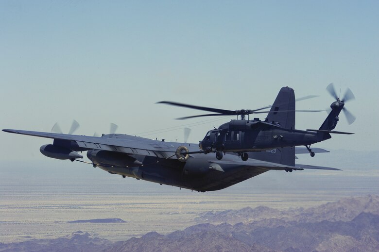 A U.S. Air Force MC-130P Combat Shadow from the 130th Rescue Squadron refuels an HH-60G Pave Hawk from the 66th RQS during a flight to Southern California for a mass casualty exercise during Angel Thunder 2015, June 11, 2015. Angel Thunder is hosted by the 355th Fighter Wing at Davis-Monthan Air Force Base, Ariz., but many flying operations extend throughout Arizona, New Mexico and California. The 66th RQS is stationed at Nellis Air Force Base, Nev., and the 130th RQS is stationed at Moffett Federal Airfield, Calif.  (U.S. Air Force photo by Senior Airman Betty R. Chevalier/Released)